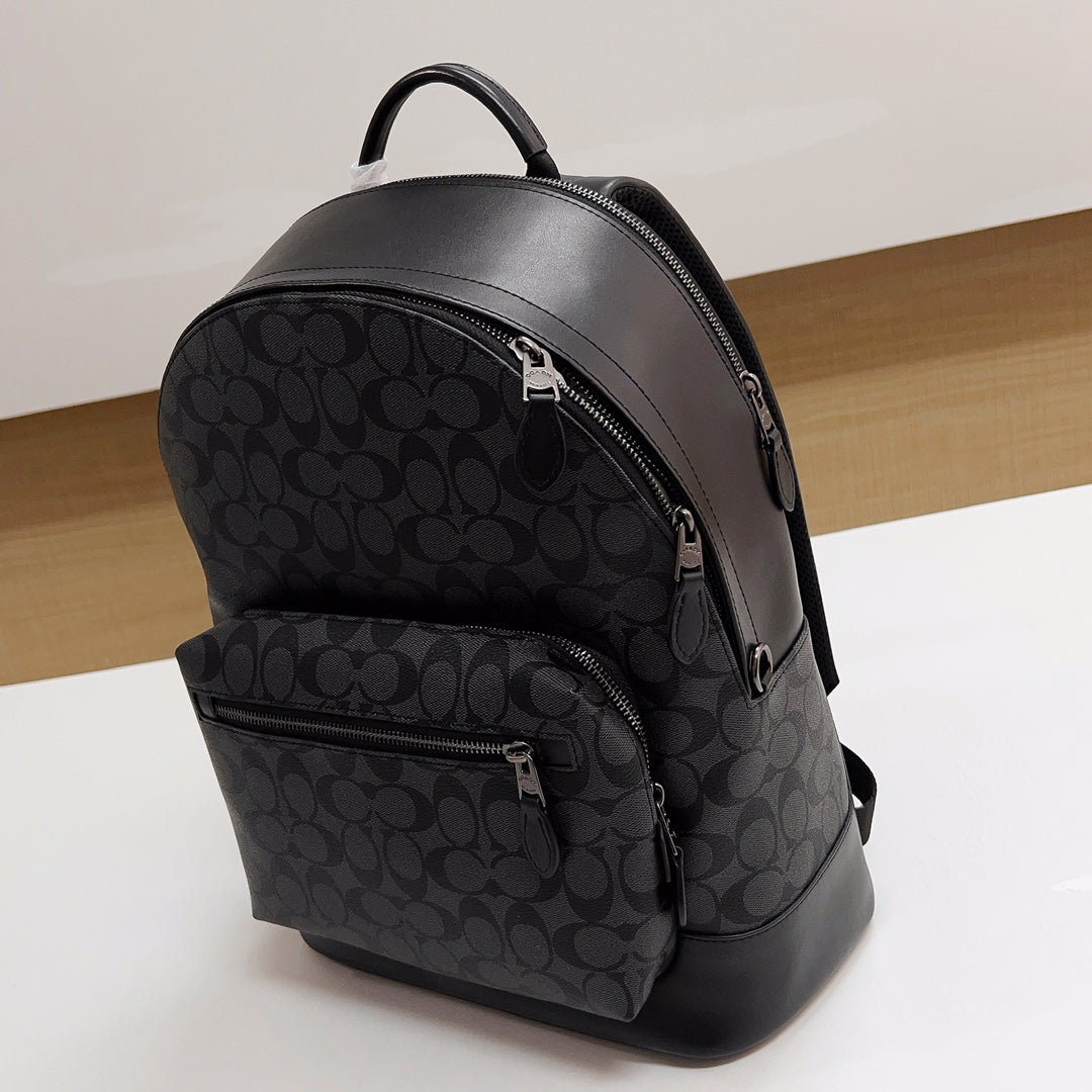 Coah backpack with curved main zipper and monogram front, dark gray