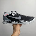 Black and white Nike basketball shoe with large Swoosh and MAX logo on heel