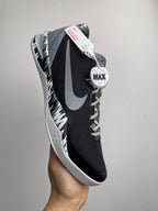 Black Nike basketball shoe with lace-up front, white Swoosh, and MAX logo