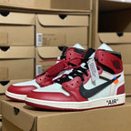 Red and white high-top sneakers with black laces and blue Swoosh