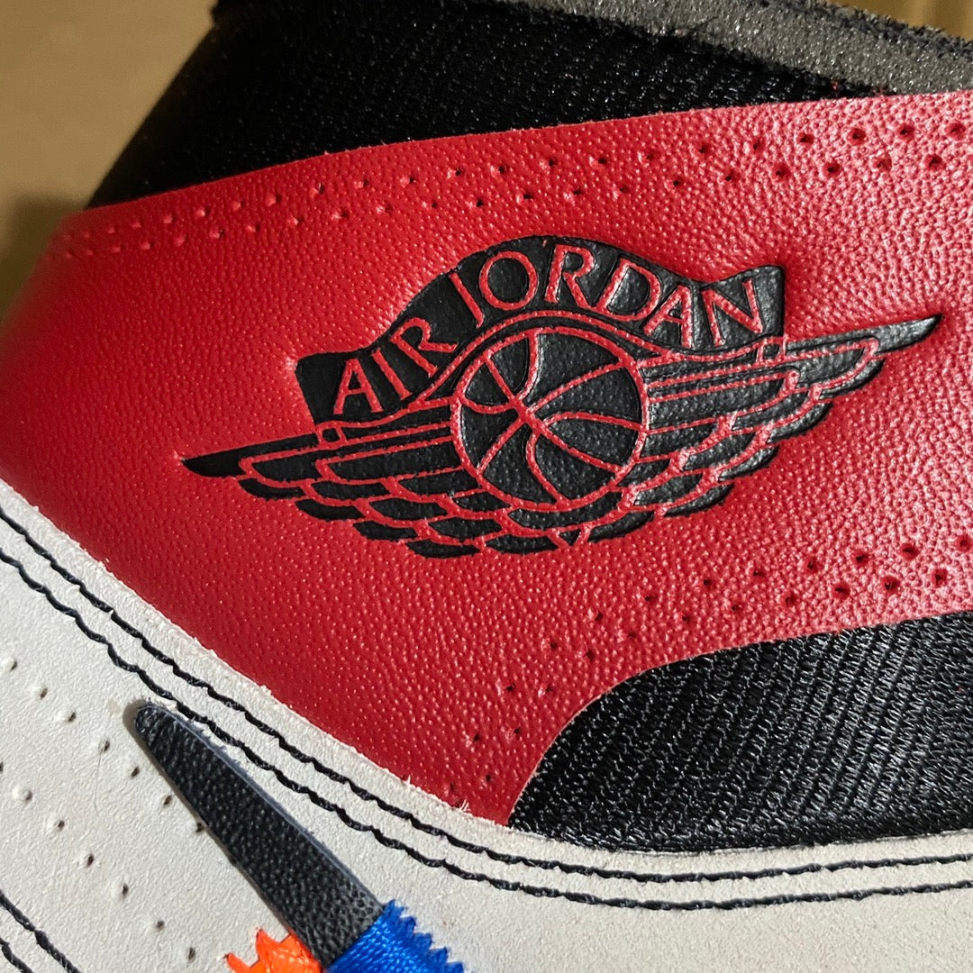 Red leather high-top sneaker with Air Jordan Wings logo on side