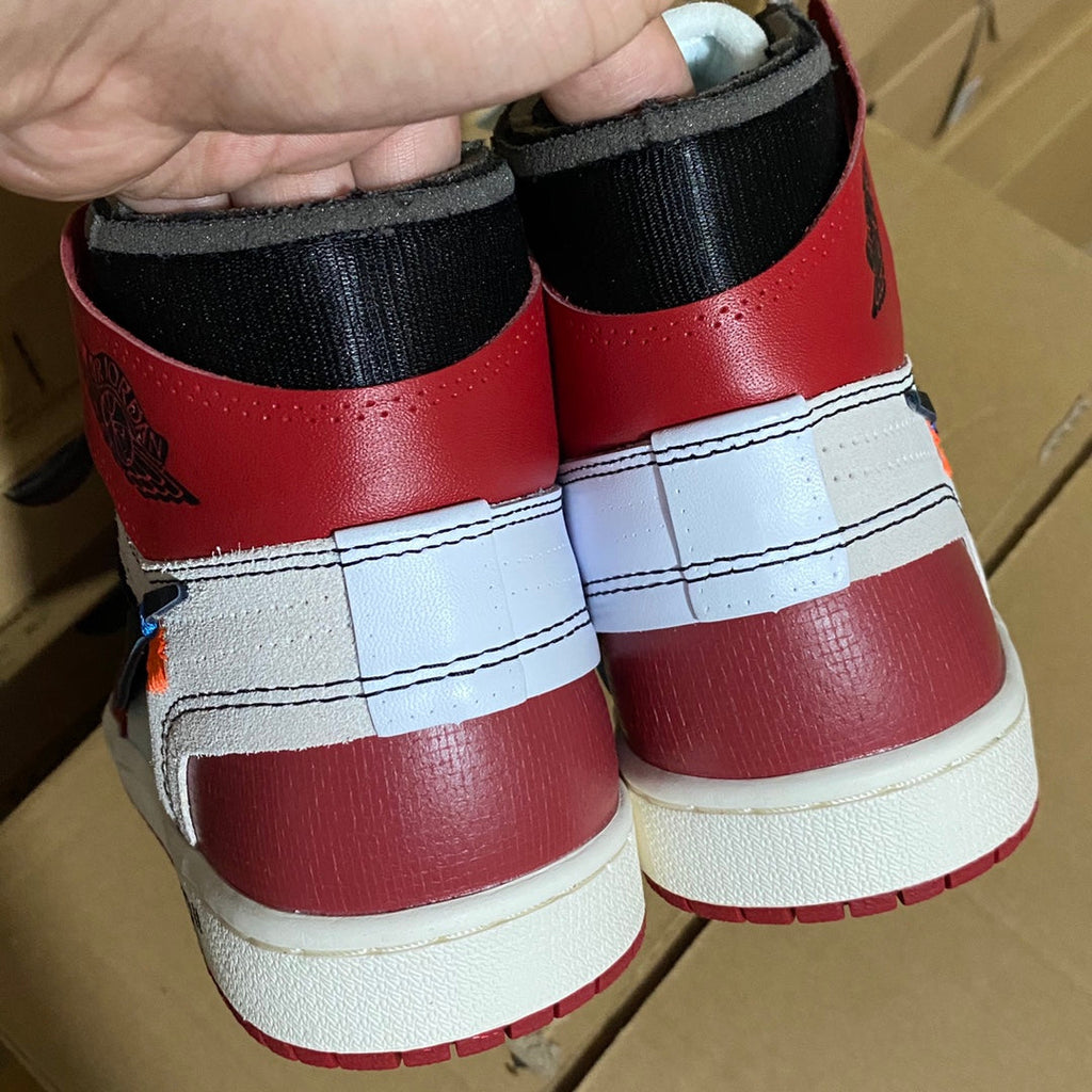 Red high-top sneakers heel with white midsoles and black fabric collar