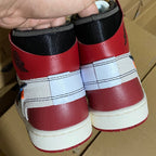 Red high-top sneakers heel with white midsoles and black fabric collar