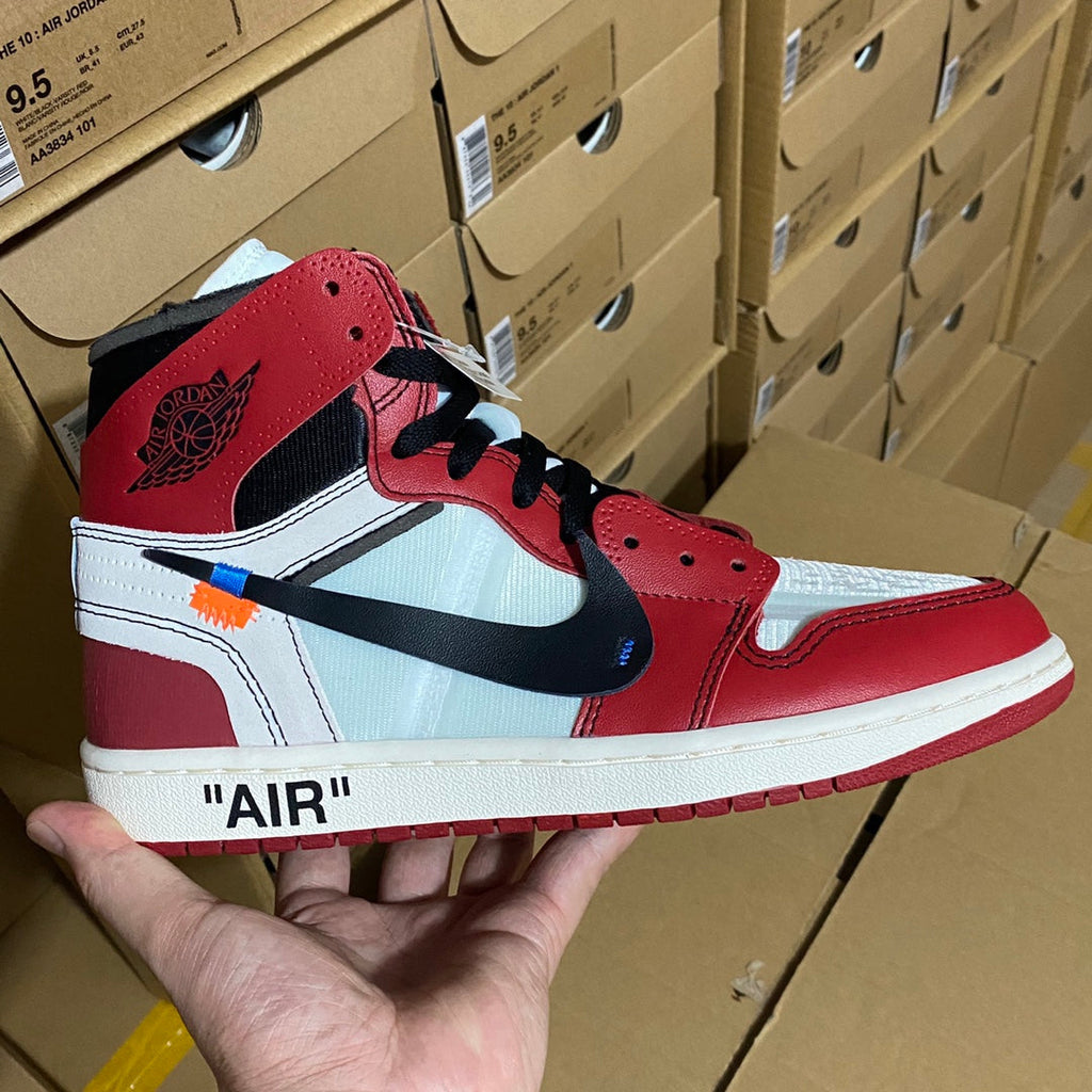 Red and white high-top sneakers with blue Nike Swoosh and black laces