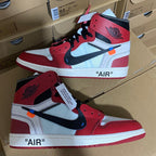 Red and white high-top sneakers with blue Nike Swoosh and black eyelets