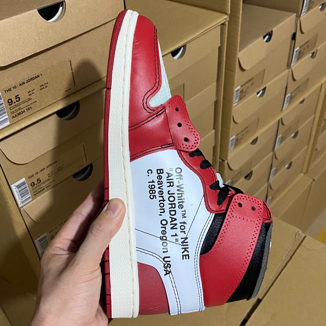 Red and white high-top sneaker with black laces and light blue collar