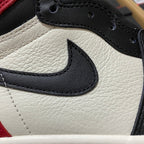White leather sneaker quarter with black Nike Swoosh and black stitched lace edge.