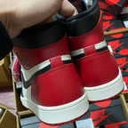 Red and black high-top sneakers with padded collar and white midsole outsole edge.