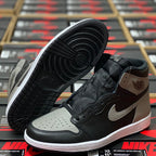 High-top sneaker side and outsole view in black, light gray, and white with lace closure