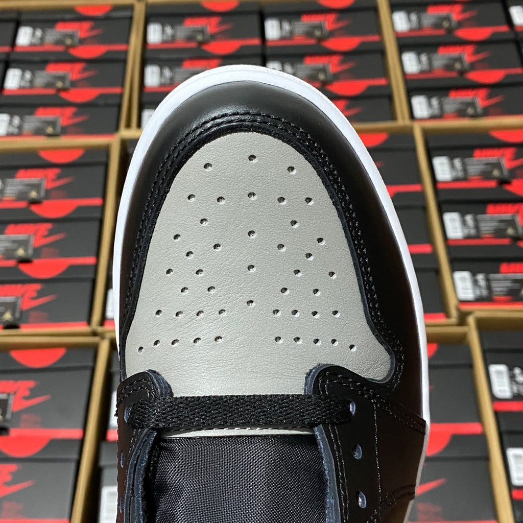 High-top sneaker vamp with perforated toe box and black overlay, light gray panel