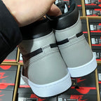 High-top sneaker heel and back panel in black and light gray with white midsole