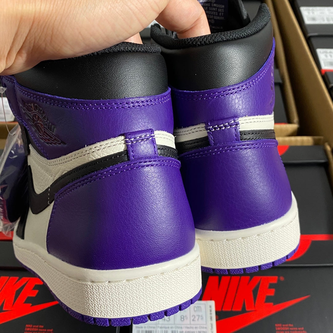 Pair of high-top sneakers showing purple ankle collars and padded black heel area