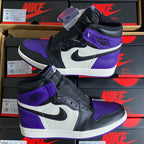 High-top sneaker pair in stacked display with black, white, and purple colorblocking