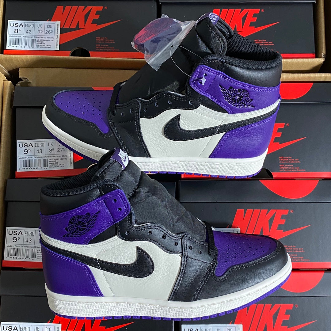 High-top sneaker pair in stacked display with black, white, and purple colorblocking