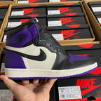 High-top sneakers with black, purple, and white panels and lace-up design