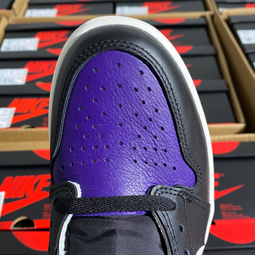 High-top sneaker toe box in purple with perforations and black eyestay trim