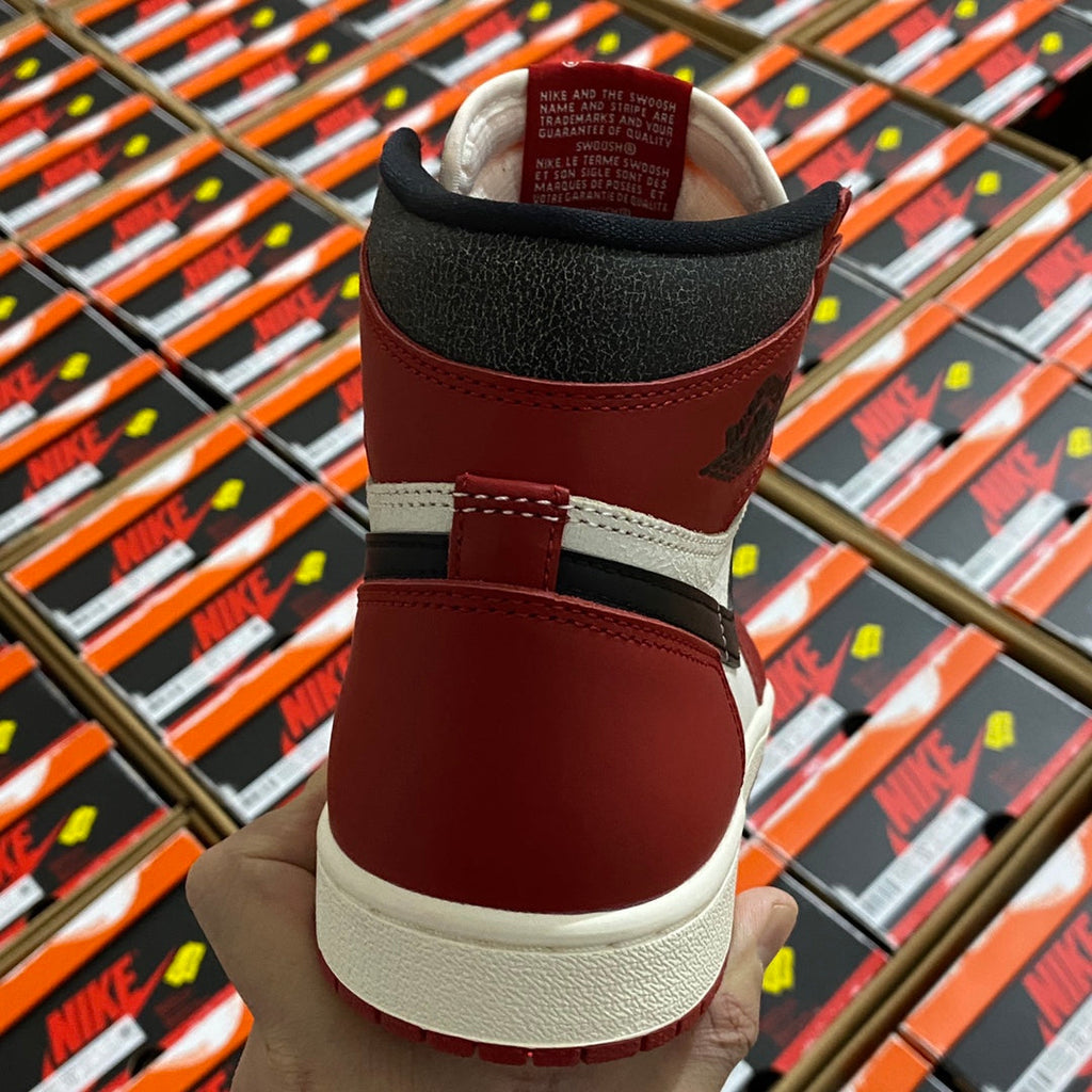 High-top sneaker heel in burgundy with black collar and cream outsole.