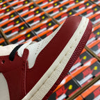 Close-up of high-top sneaker upper with burgundy leather and white side trim.
