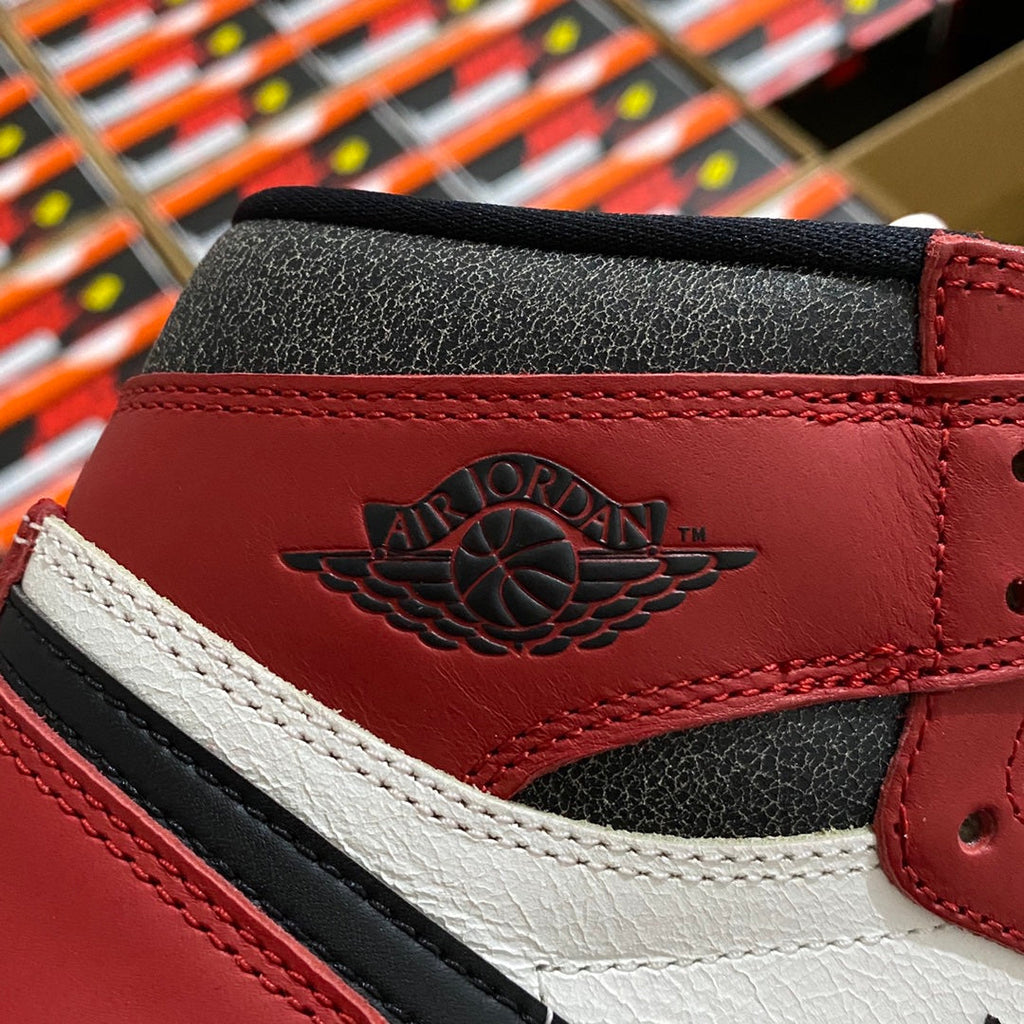 High-top sneaker ankle detail with AIR JORDAN logo, burgundy and white accents.