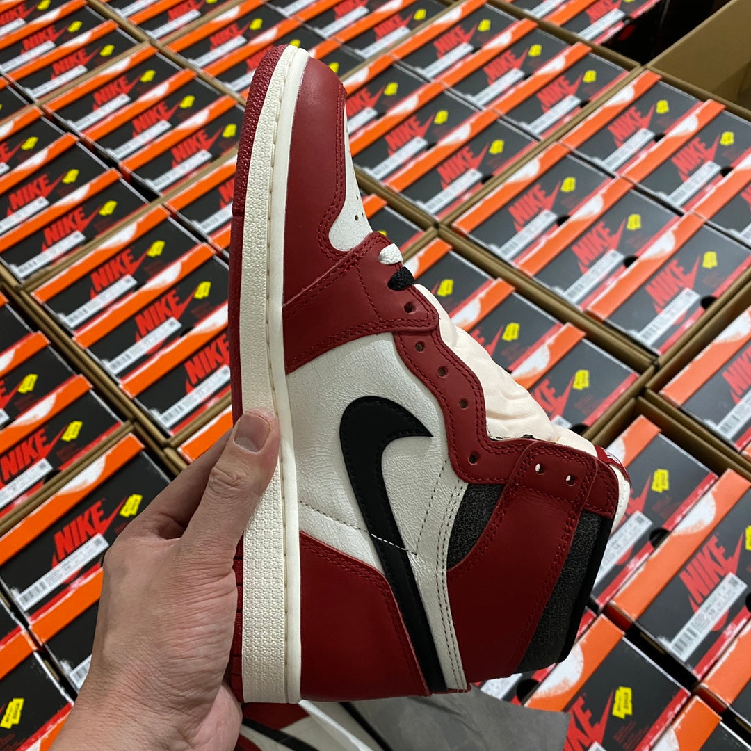 High-top sneaker side view in burgundy and white with black swoosh and laces.