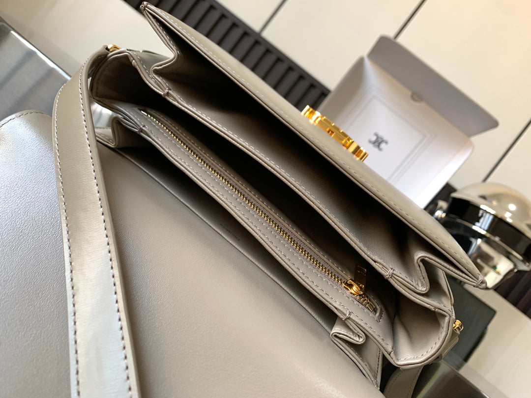 Beige Celine shoulder bag open view with double zip compartments and gold-tone hardware