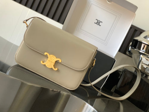 Beige Celine flap shoulder bag with gold-tone logo detail and chain strap