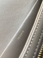Beige Celine leather interior with embossed text and stitched edge