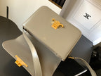 Beige Celine flap shoulder bag with gold-tone logo and crossbody strap