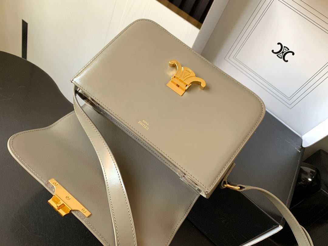 Beige Celine flap shoulder bag with gold-tone logo and crossbody strap