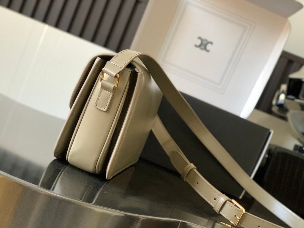 Beige Celine crossbody bag, side view with adjustable leather strap and gold buckle