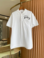White Burberry polo shirt with front pocket and script logo