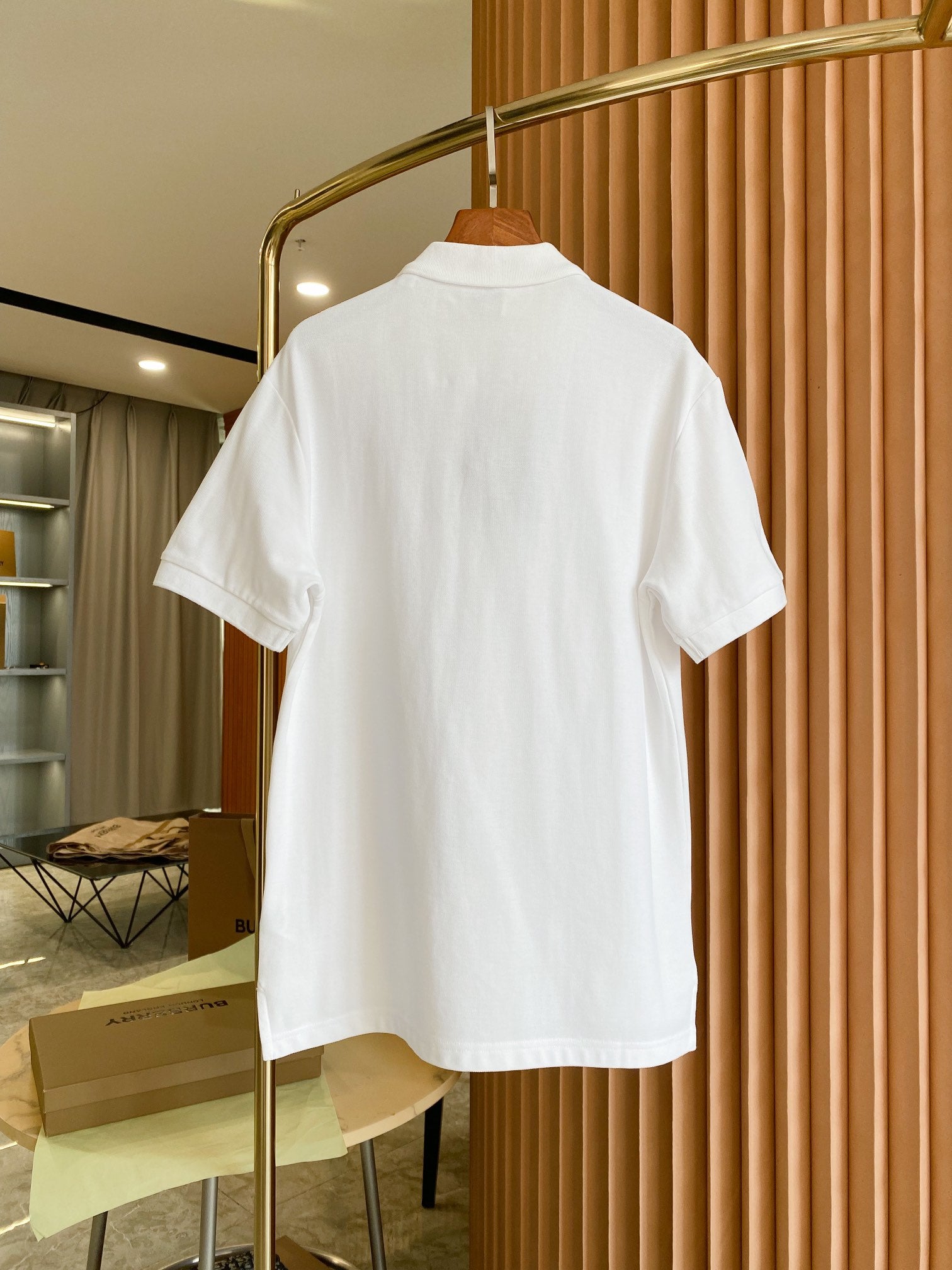 White Burberry polo shirt back view with short sleeves