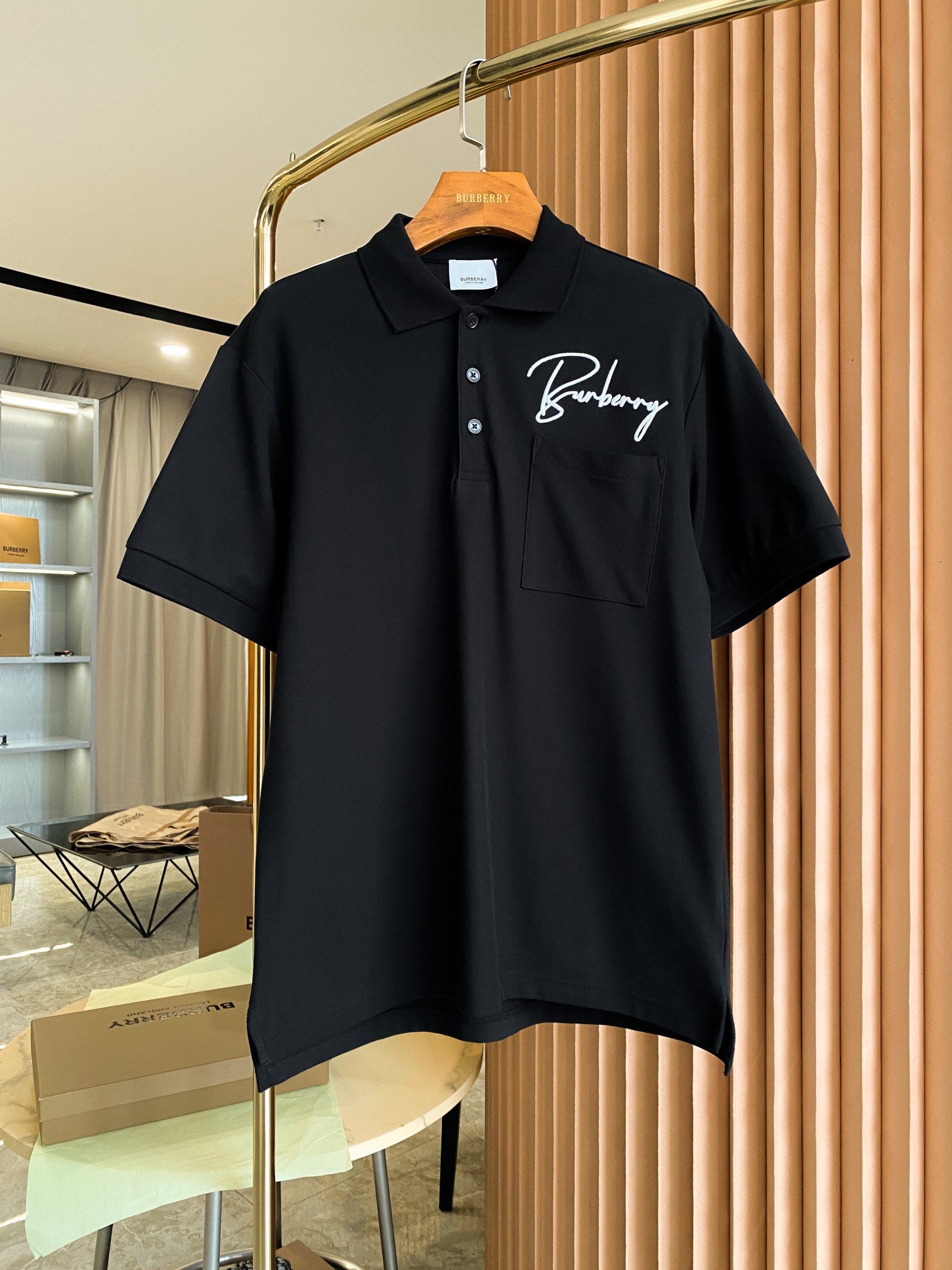 Burberry short-sleeve polo shirt in black with embroidered logo and chest pocket