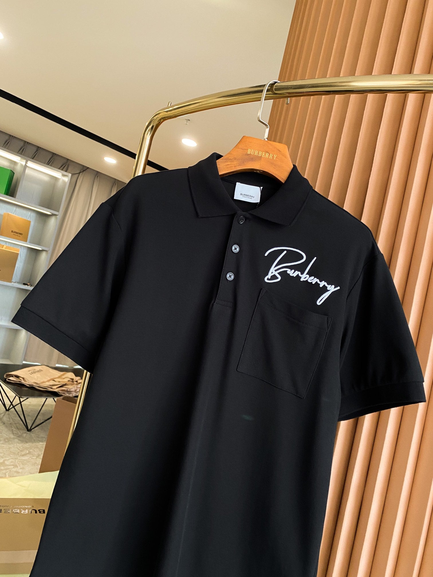 Burberry short-sleeve polo shirt in black with button placket and chest logo