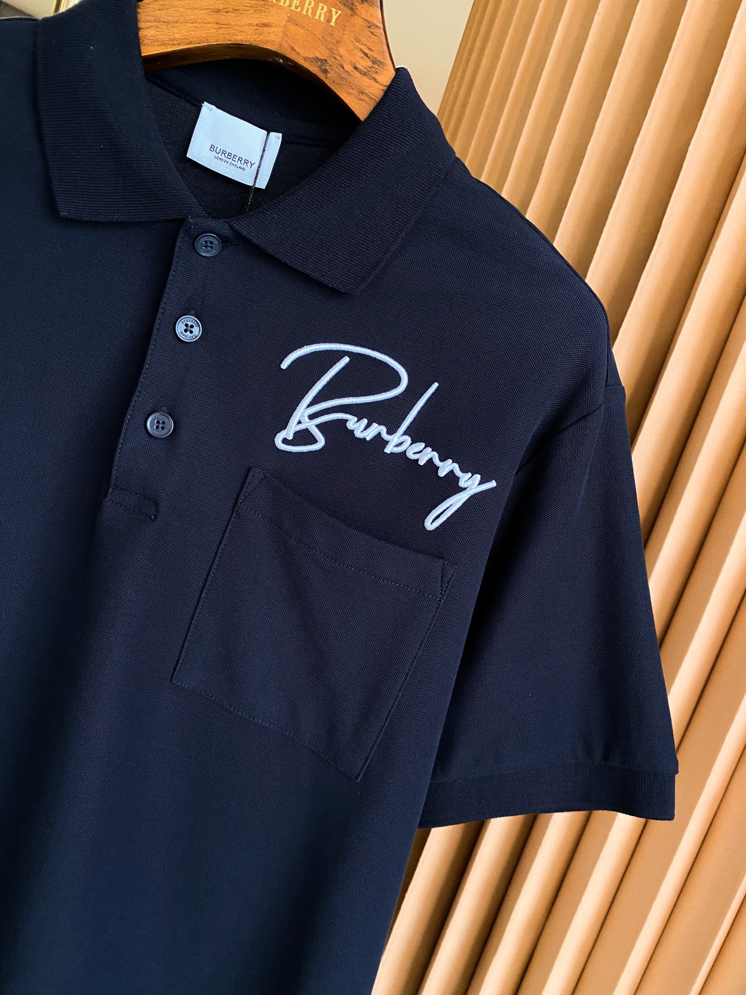 Burberry polo shirt dark navy, embroidered logo over chest pocket, buttoned collar