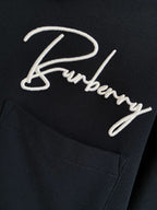 Burberry polo shirt dark navy close-up of embroidered logo script and chest pocket