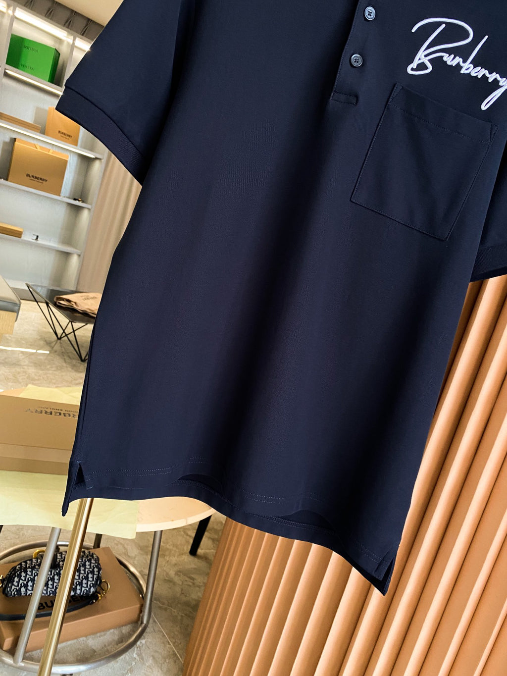 Burberry polo shirt in dark navy with chest pocket and short sleeves, button placket