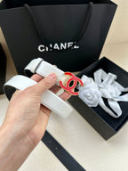 Leather belt with Chanel logo buckle, light cream strap held in hand