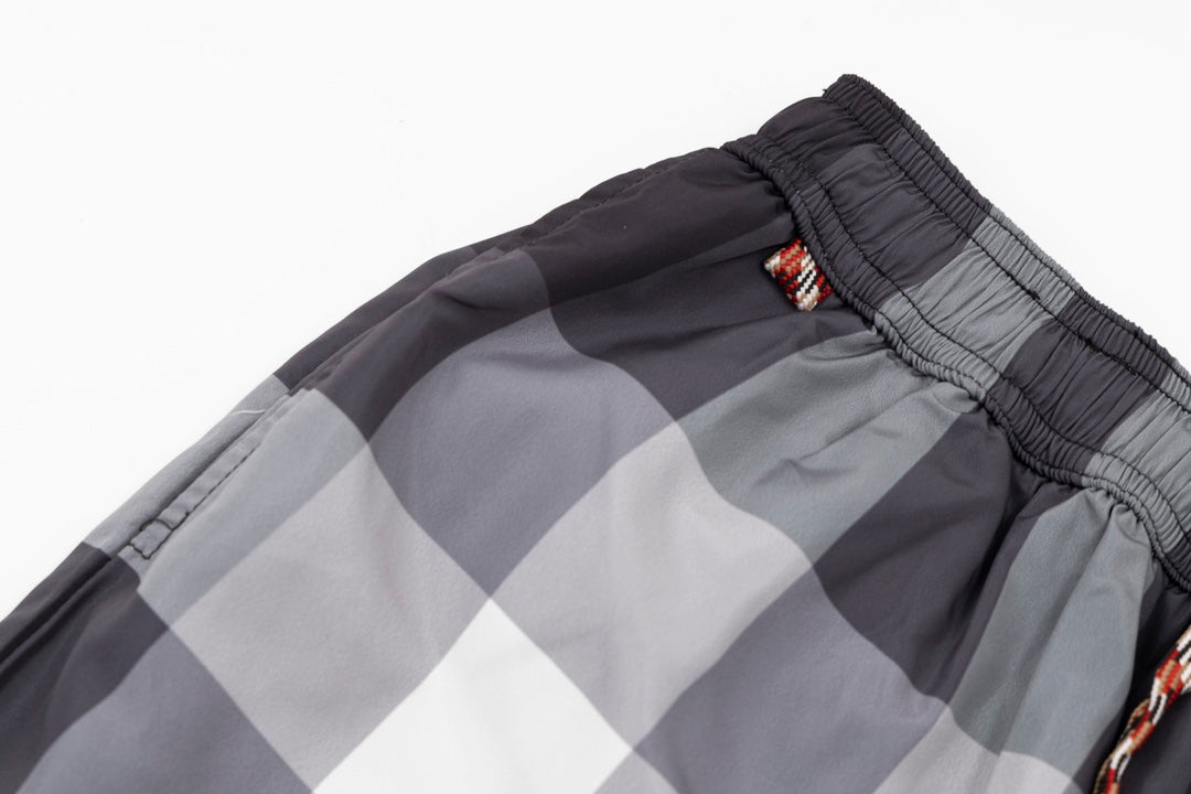 Plaid pants waistband with elastic and braided cord, dark and light gray check