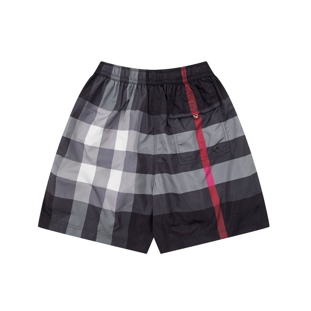Plaid pants with elastic waistband, side pocket and red vertical stripe on dark fabric