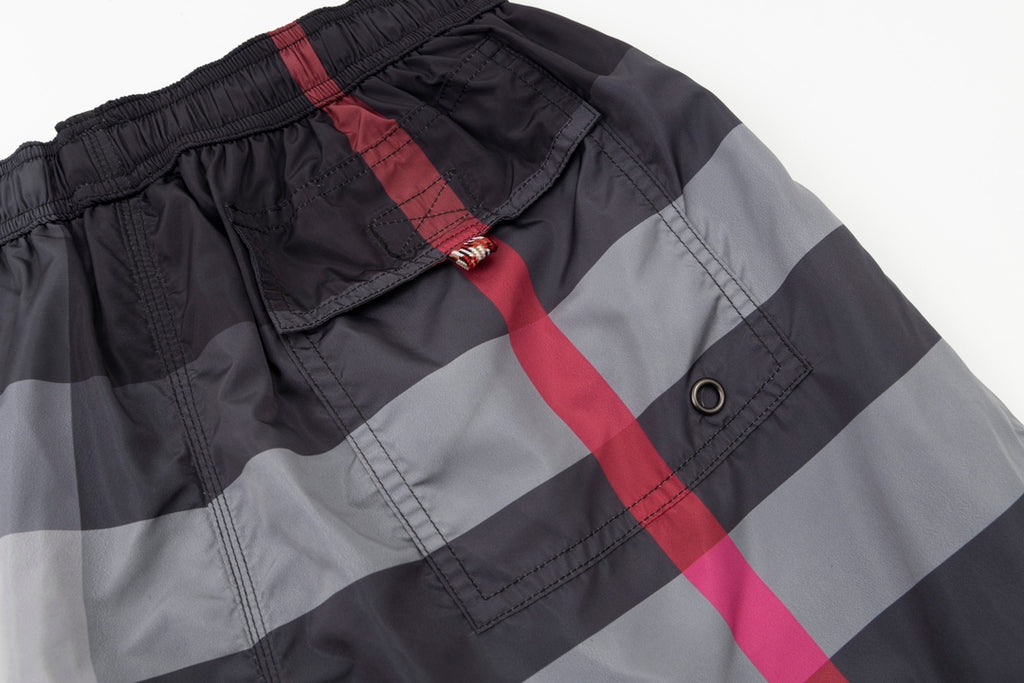 Plaid pants with cargo pocket and snap, red and black check pattern