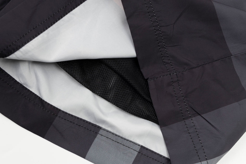 Plaid pants with interior mesh lining and stitched inner seam