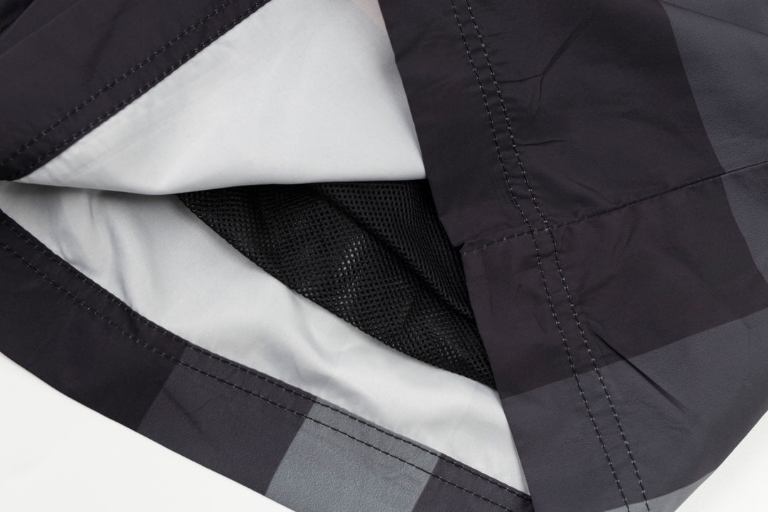 Plaid pants with interior mesh lining and stitched inner seam