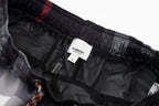 Plaid pants interior showing Burberry label and mesh lining on elastic waist