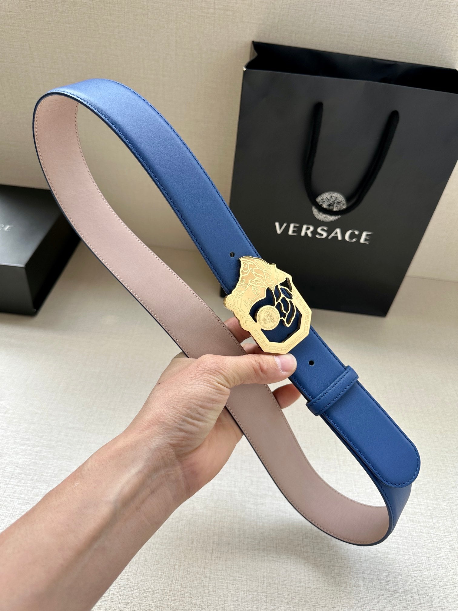 Versace belt with blue leather strap and gold-toned Medusa buckle detail