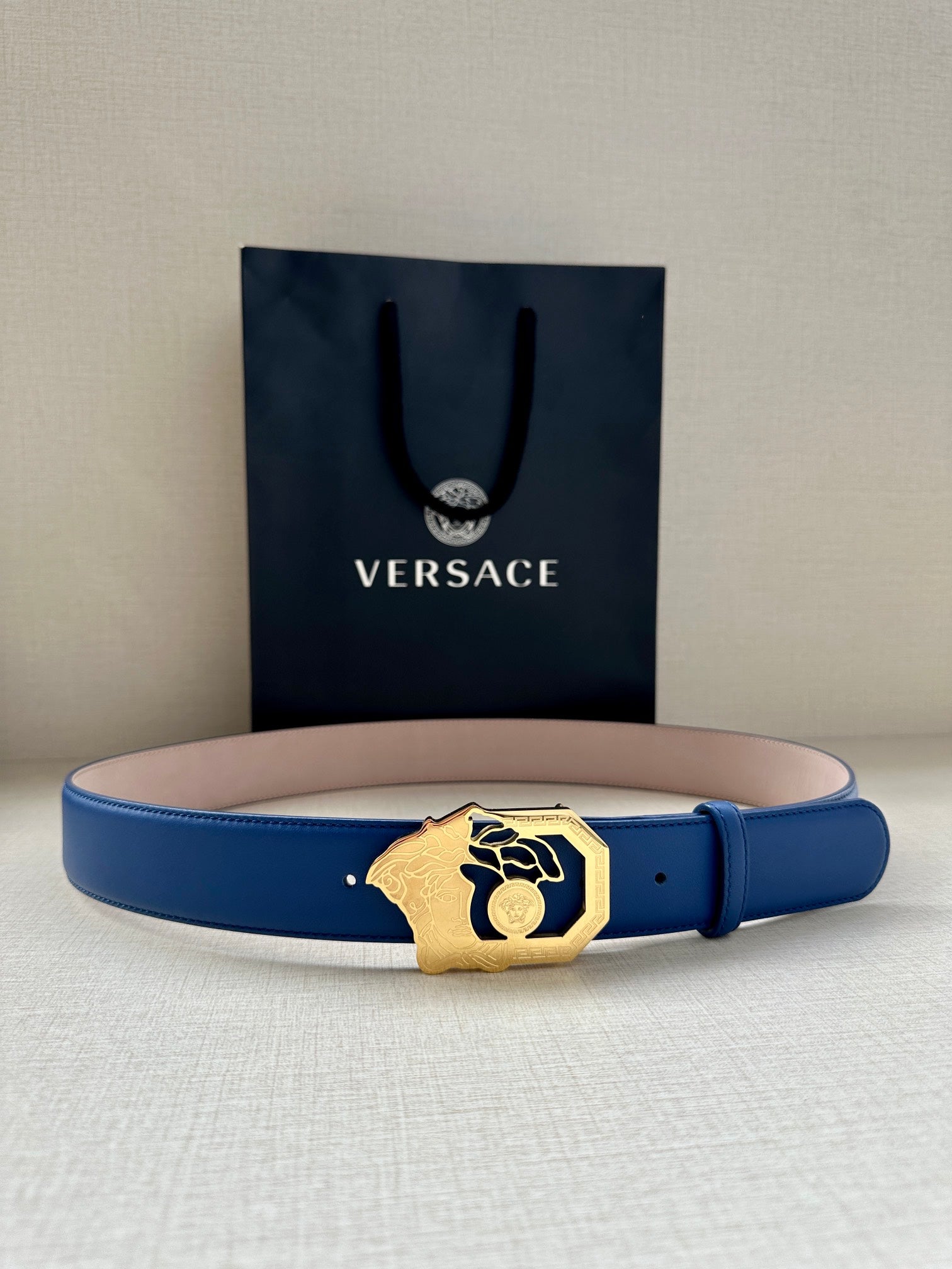 Versace belt with blue leather strap and gold-toned Medusa buckle