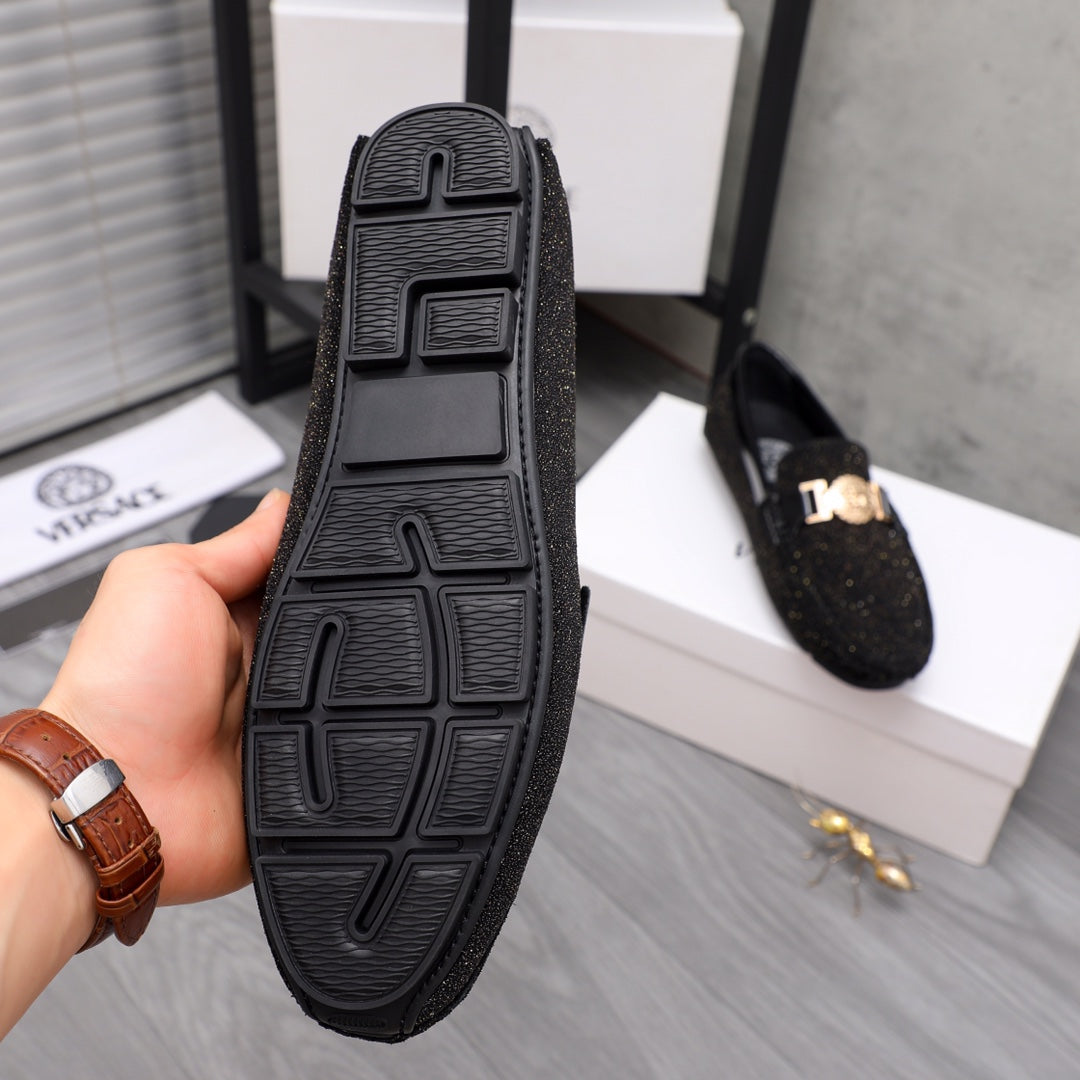 Versace black rubber outsole of loafers with molded tread, bottom view