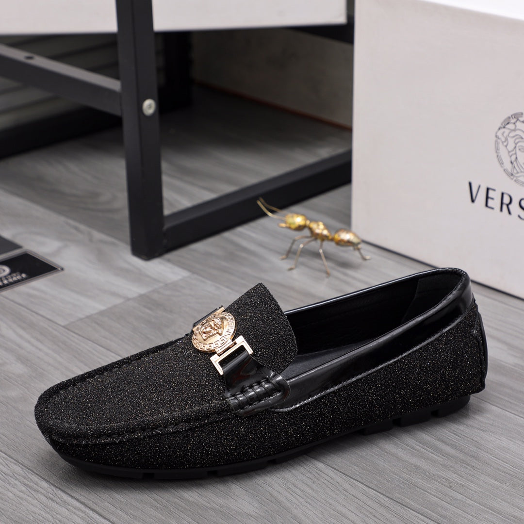 Versace black glitter loafers with gold buckle and crest emblem, side angle view