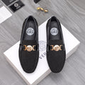 Versace black glitter loafers with gold buckle and crest emblem, pair view