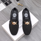 Versace black glitter loafers with gold buckle and crest emblem, pair view